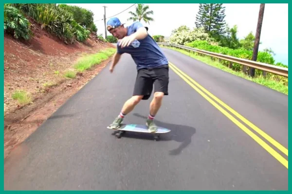 A man riding a surfskateboard